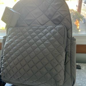 Rae Dunn back pack very cute comes with an small earbud case.